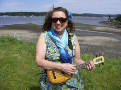 Photo of Anna (Acevedo) Lyman, at the Nanaimo seawall with her pineapple flea, ukulele, Spring 2011