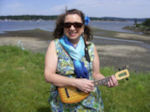 Anna Lyman at the Nanaimo seawall with her pineapple flea, ukulele