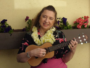 Anna playing her Lanikai ukulele, June 2010